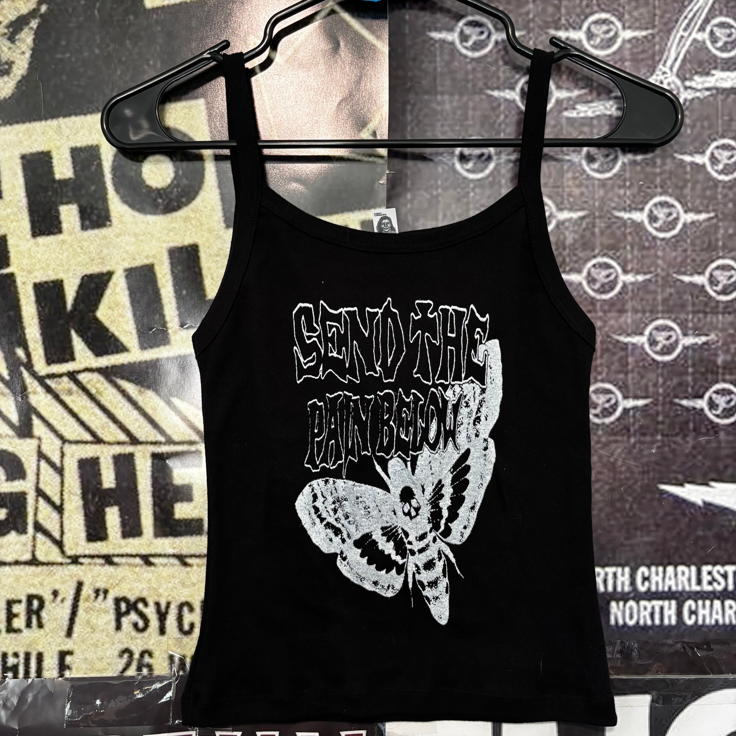 Pain below black baby tank